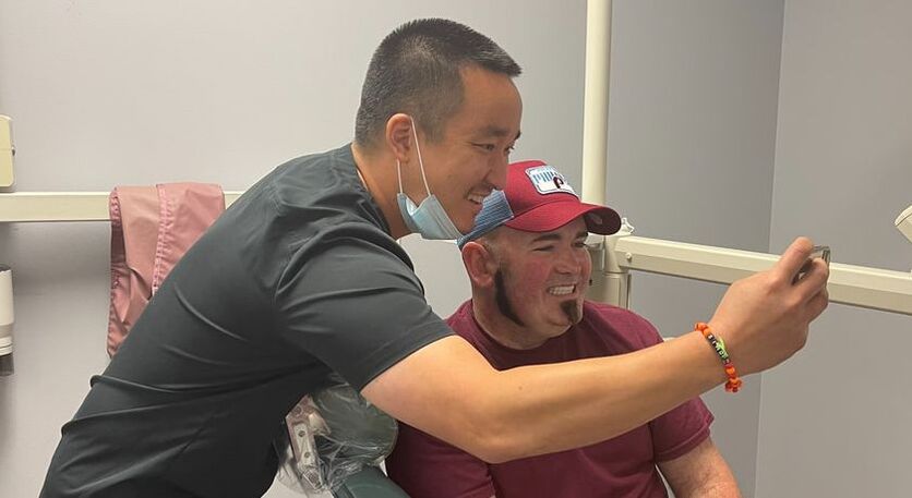 Picture of Dr. Simon Oh taking a selfie with Patient Greg Cuta