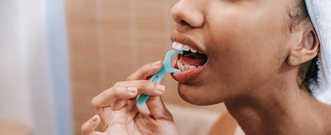 Picture of a woman flossing